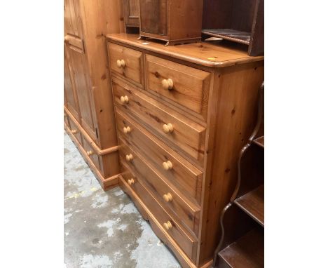 Modern pine chest of two short and four long drawers with bun handles 102cm wide, 131cm high45.5cm deep. Various light scuffs