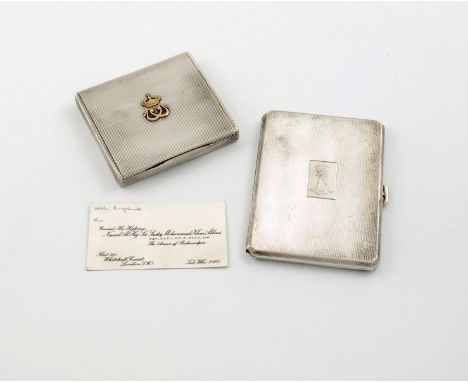 A French silver cigarette case, retailed by Gustave Keller, Paris, rectangular form, reeded decoration, the hinged cover appl