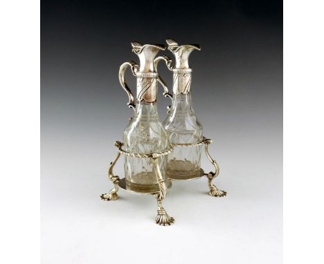 A George III silver two-bottle oil and vinegar stand, by R. Piercy, London 1767, double circular form, gadroon wirework frame
