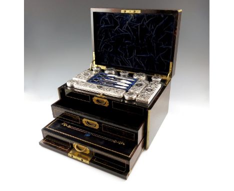 A Victorian silver-mounted travelling toilet set, by Thomas Johnson, London 1860, the mounts with chased and engraved foliate