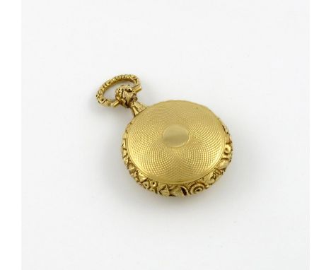 A 19th century gold watch vinaigrette, unmarked, circular form, engine-turned decoration, foliate scroll border, the hinged c