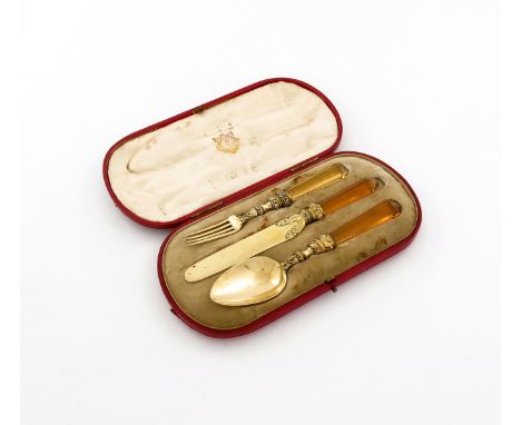 A George III silver-gilt and citrine handled three-piece christening set, maker's mark ?S, London 1818, comprising a knife, f