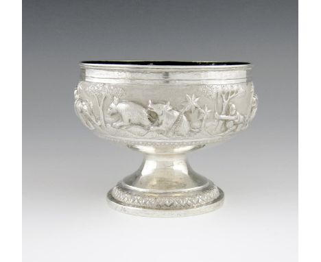 A late 19th century Indian silver bowl, probably Lucknow circa 1900, circular form, embossed with hunting scenes, on a raised