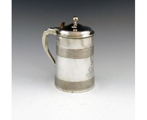 A George III silver tankard, by John Robins, London 1801, tapering circular form, with an upper and lower reeded girdle, scro