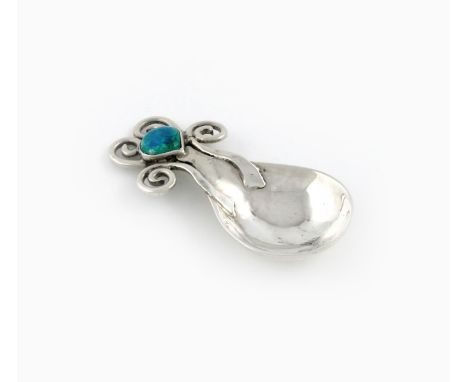 By Omar Ramsden and Alwyn Carr, an Edwardian Arts and Crafts silver and enamel caddy spoon, London 1907, spot-hammered fig-sh