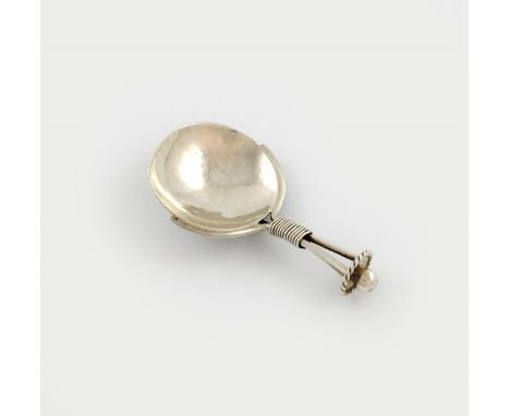 By A. E. Jones, an Arts and Crafts silver caddy spoon, Birmingham 1919, circular spot-hammered bowl, tapering wire-work handl