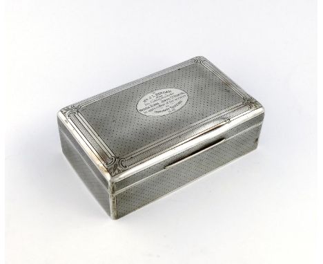 A large Edwardian silver cigarette box, by William Comyns, London 1902, engine-turned decoration in the French manner, the so