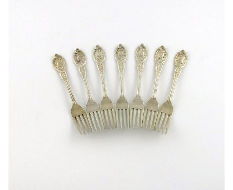 A set of seven Victorian silver Private-Die dessert forks, by George Adams, London 1862, the terminals with an axe and wreath