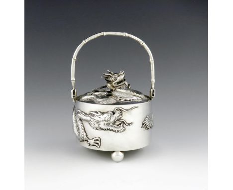 A Chinese silver jam pot and cover, by Luen Wo, Shanghai circa 1920, circular form, the body applied with a dragon, simulated