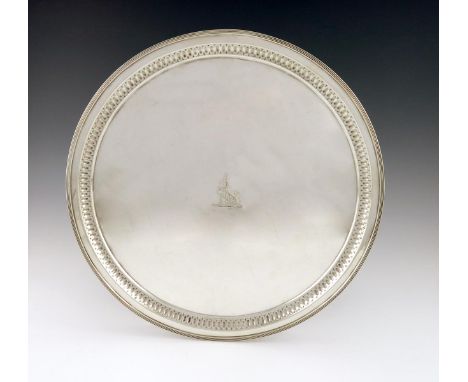 A late-Victorian silver salver, by E. Hutton, London 1892, circular form, fluted decoration, reeded border, the centre with a