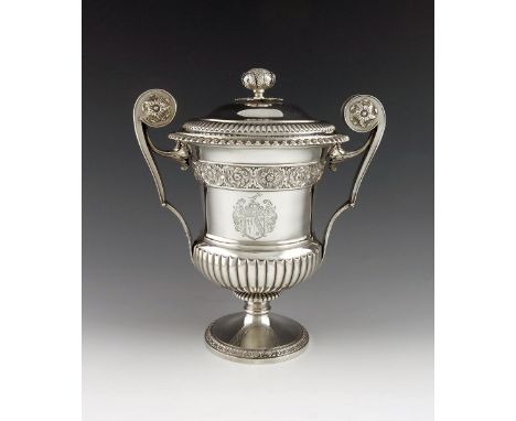 A George IV silver two-handled cup and cover, by William Eaton, London 1822, campana shaped body, part-fluted decoration, scr