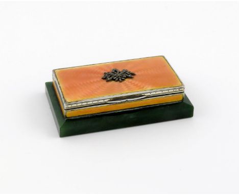 A German silver and orange enamel triple stamp box, possibly by Mayer, rectangular form, the hinged cover set with a marcasit