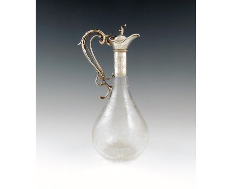 A Victorian silver mounted glass claret jug, by E.C. Brown, London 1868, baluster form with etched decoration, engraved mount