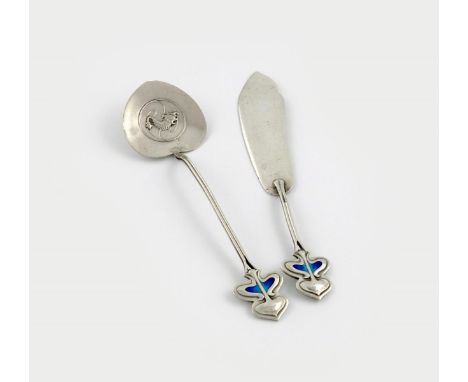 An Art Nouveau silver and enamel butter knife and spoon, by R. W. Hewett and Co, Birmingham 1905, the terminal with two colou