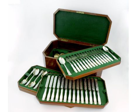 A Victorian silver-gilt and parcel-gilt composite Bacchanalian pattern dessert service for fourteen,the spoons by Henry Lias 