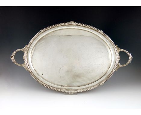 An Edwardian silver two-handled tray, by Pearce and Sons, Sheffield 1906, oval form, gadroon and shell border, length handle 