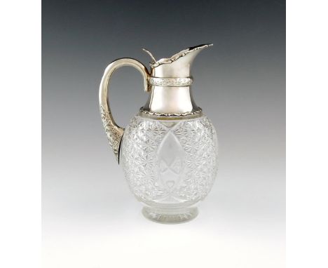 A silver mounted glass claret jug, by Walker & Hall, Sheffield, date letter worn, tapering circular form, with hob-nail cut d