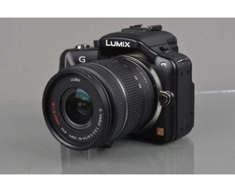 A Panasonic Lumix G3 Digital Camera, black, shutter working, touch screen working, flash working, body VG, with G Vario 14-42