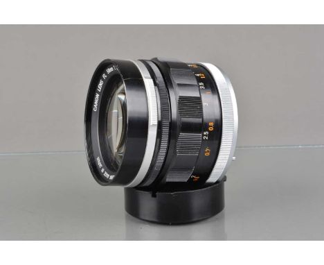 A Canon FL 58mm f/1.2 Lens, serial no 40971, barrel G, light paint wear to grip, elements G-VG, with front and rear caps