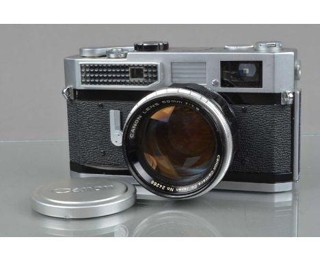 A Canon 7 Rangefinder Camera, chrome, serial no 890322, shutter working, light cell responsive, rangefinder functions, self t