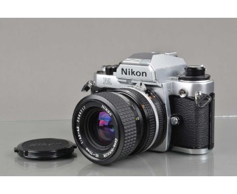 A Nikon FA SLR Camera, chrome, serial no 5091431, shutter working, meter responsive, self timer working, body VG, with Nikon 