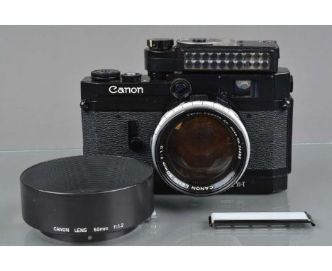 A Canon VI-T Rangefinder Camera, black, serial no 618609, shutter working, rangefinder functions, rapid wind smooth, self tim