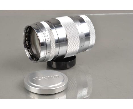 A Canon 85mm f/1.9 Lens, Canon screw mount, chrome, serial no 68121, barrel G-VG, light marks to grip, elemens G, light clean