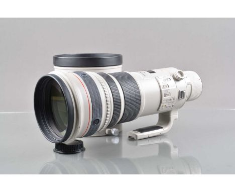 A Canon EF 500mm f/4 L IS USM Lens, serial no 30316, auto focus working, barrel G-VG, light fading to grip, elements VG-E, wi