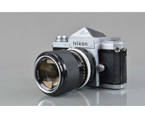 A Nikon F SLR Camera, chrome, serial no 6864146, shutter working, self timer working, body G, some paint wear to edges, tiny 