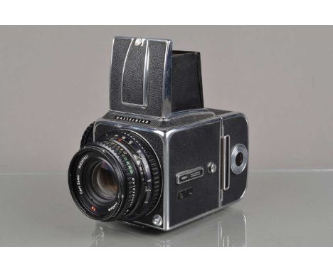 A Hasselblad 500C Camera, chrome. Serial no TI 55575, shutter working, body G, some light wear to base plate, with Carl Zeiss