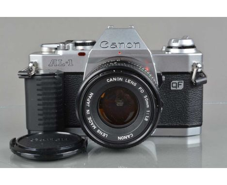 A Canon AL-1 QF SLR Camera, serial no 1050862, shutter working, meter responsive, self timer working, body G-VG, with Canon F