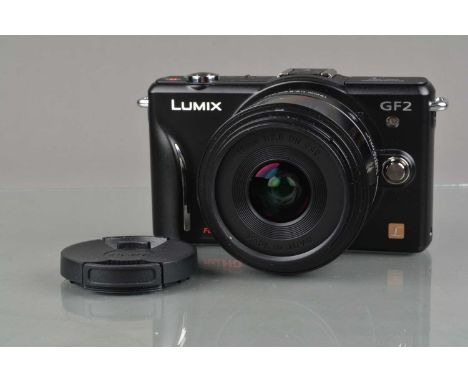 A Panasonic Lumix GF2 Digital Camera, black, powers up, shutter working, display screen working, appears to function as shoul