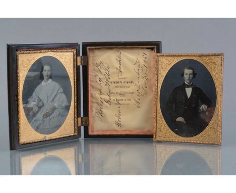 A mid-19th Century Double Portrait Pair of Quarter-Plate Ambrotypes of a Couple, with coloured and gilt highlights, in Peck g