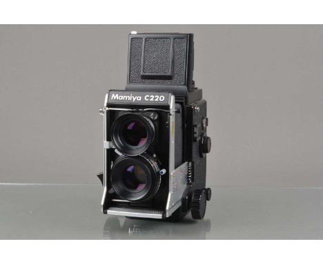 A Mamiya C220 Professional F TLR Camera, serial no W 109554, body G-VG, some light paint scratches to top film door and top f