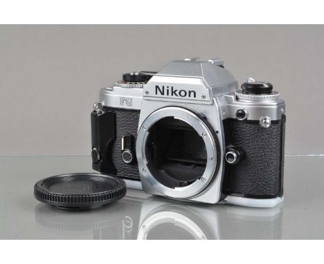 A Nikon FG SLR Camera Body, chrome, serial no 8497264, shutter working, meter responsive, self timer working, body G-VG, ligh