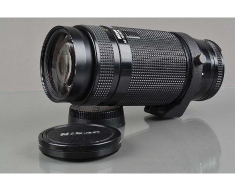 A Nikon AF Nikkor 75-300mm f/4.5-5.6 Lens, serial no 324823, auto focus working, barrel G, light wear, elements VG, with fron