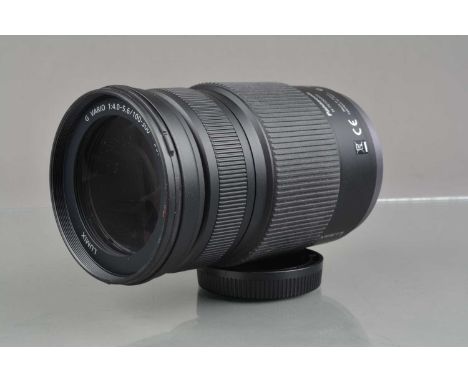 A Panasonic H-FS100300 Lumix G Vario 100-300mm f/4-5.6 Mega O.I.S. Lens, focusing working, barrel VG, elements VG, with front