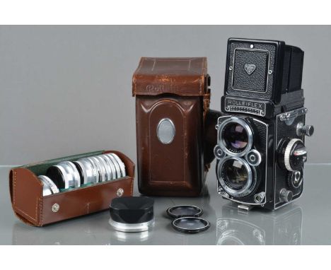 A Rolleiflex 2.8F TLR Camera, serial no 2403627, shutter working, meter responsive, body G-VG, some light wear, with Carl Zei