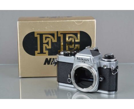 A Nikon FE Camera Body, chrome, serial no 4431166, shutter working, meter responsive, self timer working, body VG, with manua