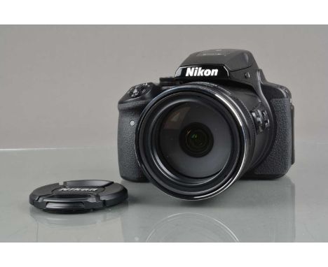 A Nikon CoolPix P900 Digital Camera, black, shutter working, flash working, display screen working, appears to function as sh