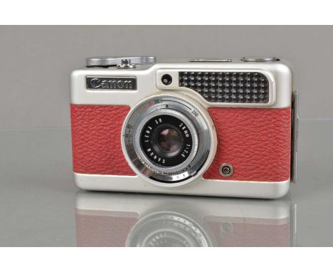 A Canon Demi Half Frame Camera, red, shutter working, light cell responsive, body G, elements G-VG