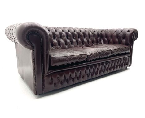 Three seat Chesterfield sofa upholstered in deeply buttoned burgundy leatherDimensions: Height:&nbsp;72cm&nbsp; Length/Width: