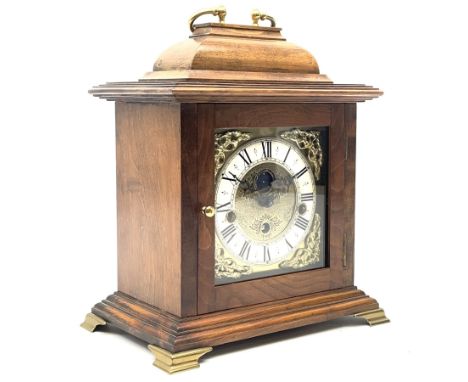 Late 20th century walnut cased bracket clock, sarcophagus top with loop handle, the brass dial with penny moon phase, Roman c