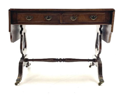 20th century walnut drop leaf sofa table, shaped drop leaf top over two drawers, on lyre shaped end pillars with splayed reed