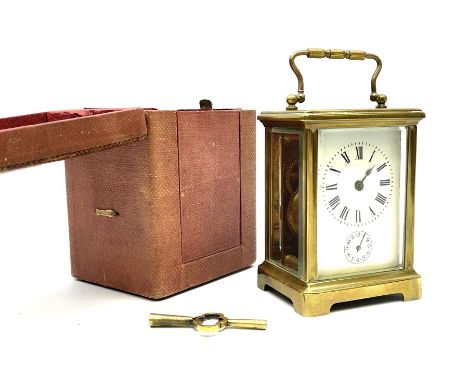 Early 20th century brass and bevel glazed carriage alarm clock, white enamel Roman dial with alarm set dial, single train mov