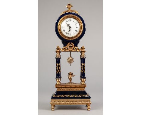 TWENTIETH CENTURY CONTINENTAL GILT METAL MOUNTED PORCELAIN PORTICO SMALL MANTLE OR DRESSING TABLE CLOCK, blue glazed and heig