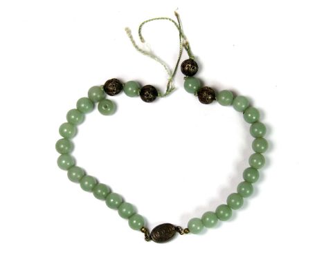 A Chinese antique jade and silver necklace (in need of re-threading).