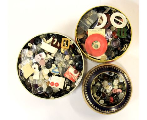 Three tins of vintage buttons.