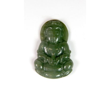 A Chinese carved green jadeite jade amulet of the seated goddess Guanyin, H. 5cm.
