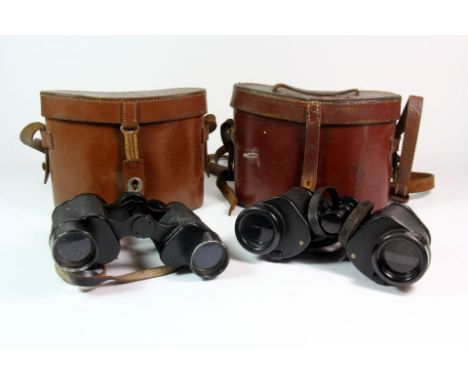 A pair of Barr and Straud vintage binoculars and a further pair of Saarburg binoculars.